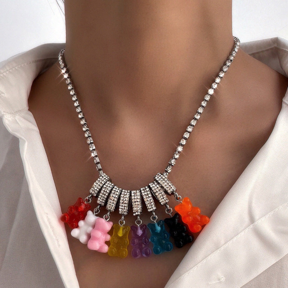 Tennis chain necklace with multicolored gummy bear pendants on model – trendy rainbow bear charm bling jewelry, statement necklace.