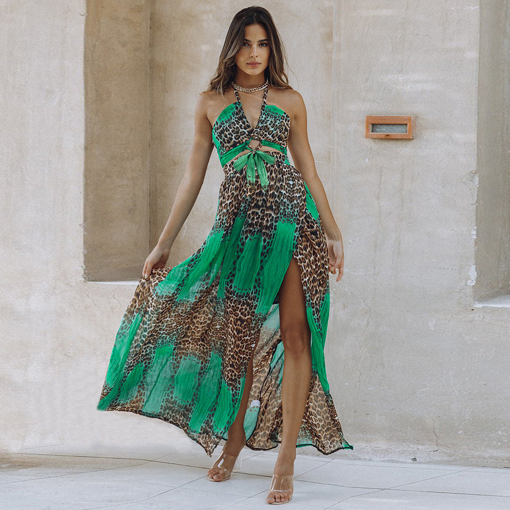Leopard print green maxi dress on model – trendy animal print color-block long dress with slit and tie detail, studio stone wall background.