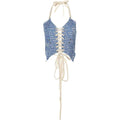 Blue number print halter crop top with white lace-up corset front, adjustable halter neck ties, and long dangling tie strings. Features an all-over white numeric pattern on blue fabric.