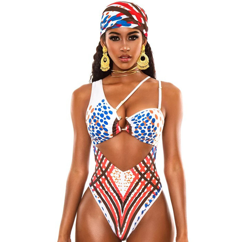 Woman wearing a colorful patterned swimsuit with a headscarf on a white background