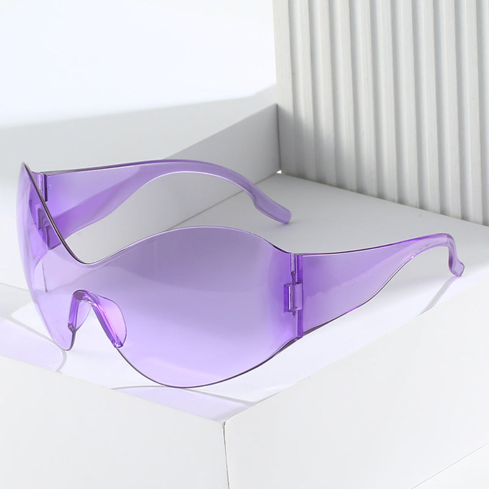Purple sunglasses on a white surface with a light gray background
