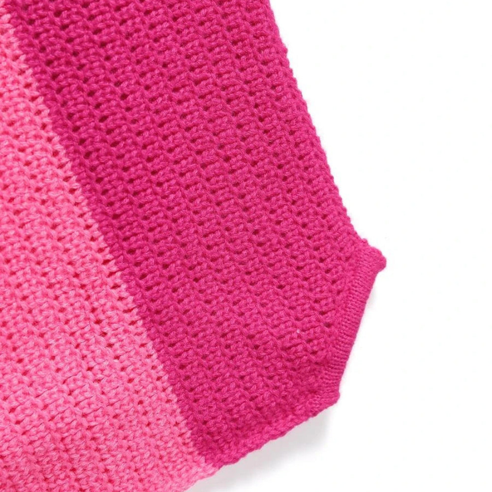 Close-up detail of pink ribbed knit fabric texture. Boutique Jolie summer apparel.