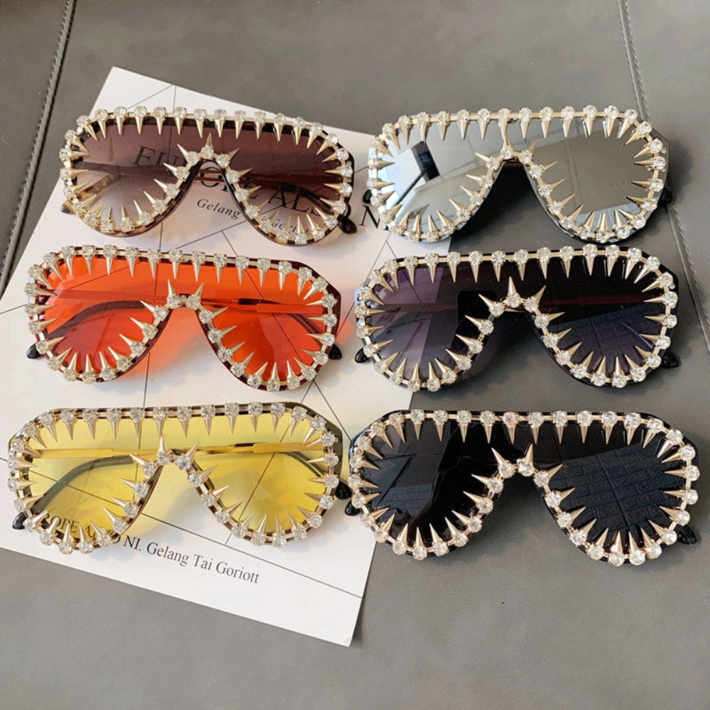 Multi-color spiked crystal sunglasses set – trendy gold statement designer sunnies with spikes and rhinestones, product flat lay.