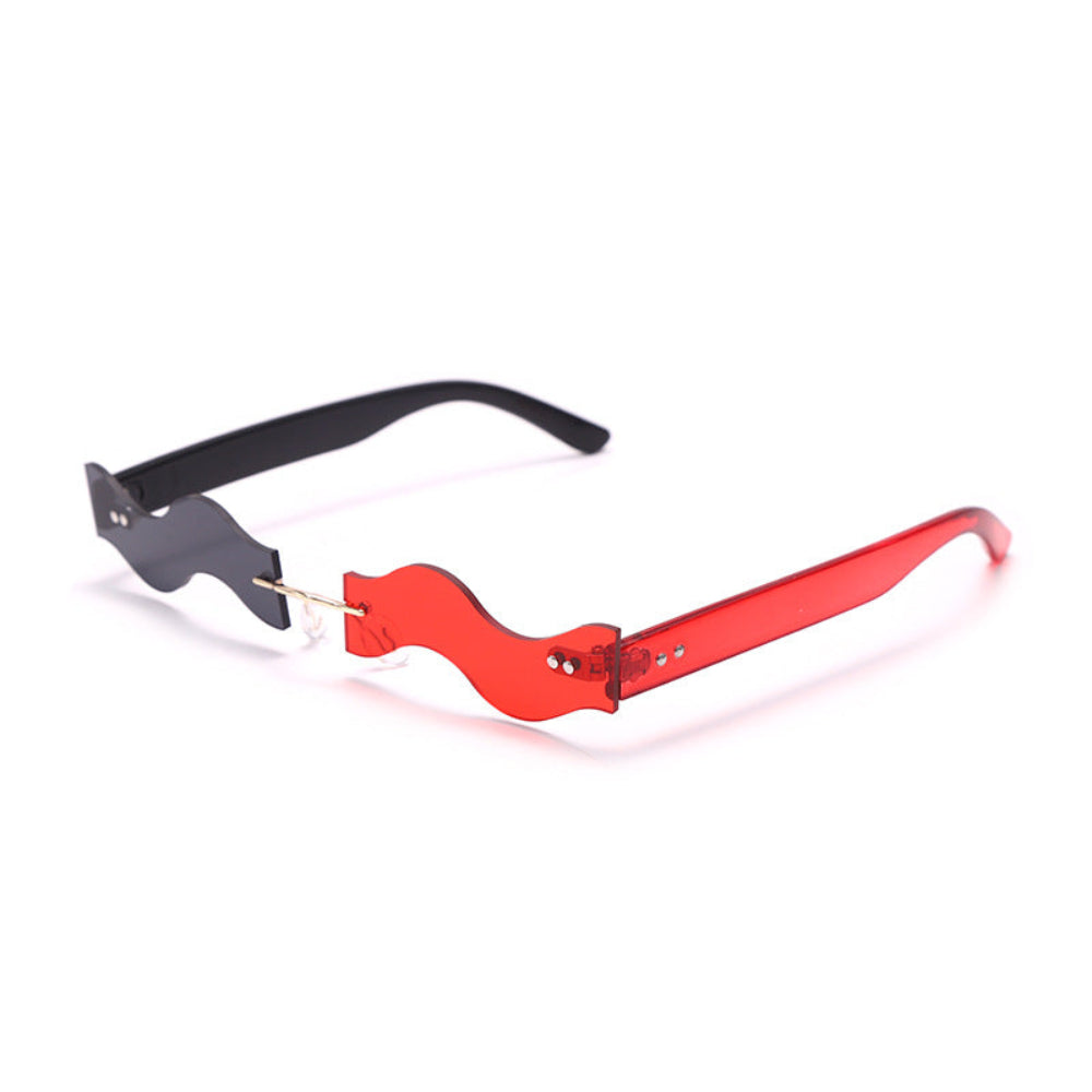 Rimless wavy sunglasses with one black lens and one red lens, product photo on a white background.