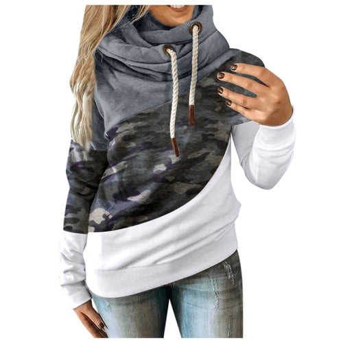 Color-block cowl-neck hoodie with grey, camo, and white panels, shown on a model.