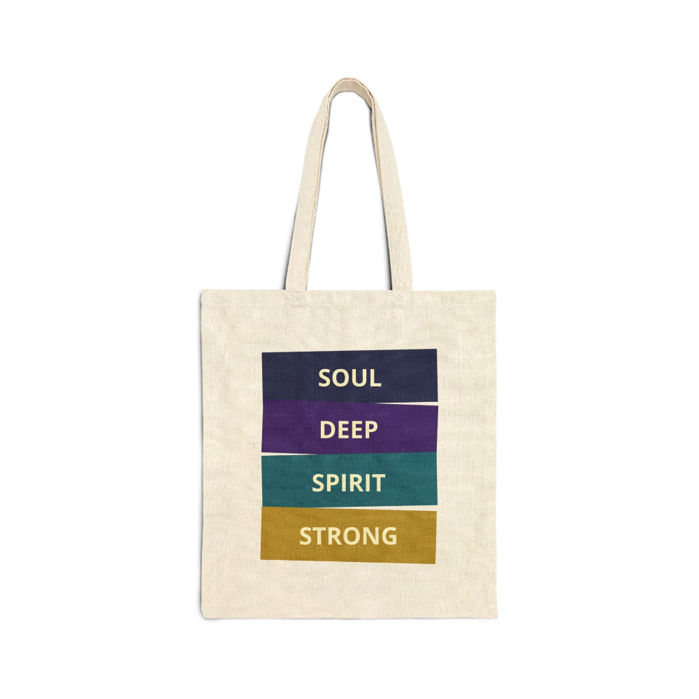 Natural canvas tote bag with "SOUL DEEP SPIRIT STRONG" motivational quote in colorful stacked blocks (navy, purple, teal, gold) against white background.