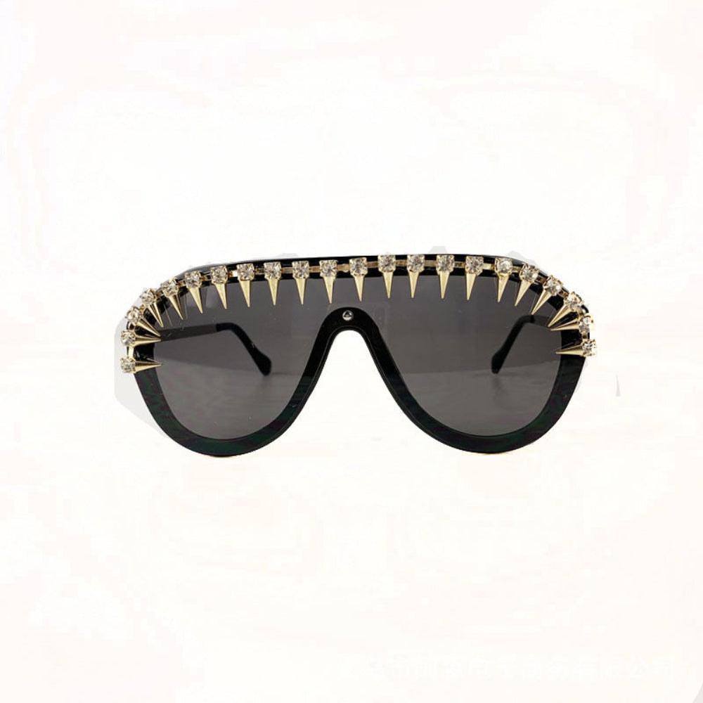 Black gold spike crystal shield sunglasses – trendy statement designer sunnies with spikes and rhinestones, studio white background.