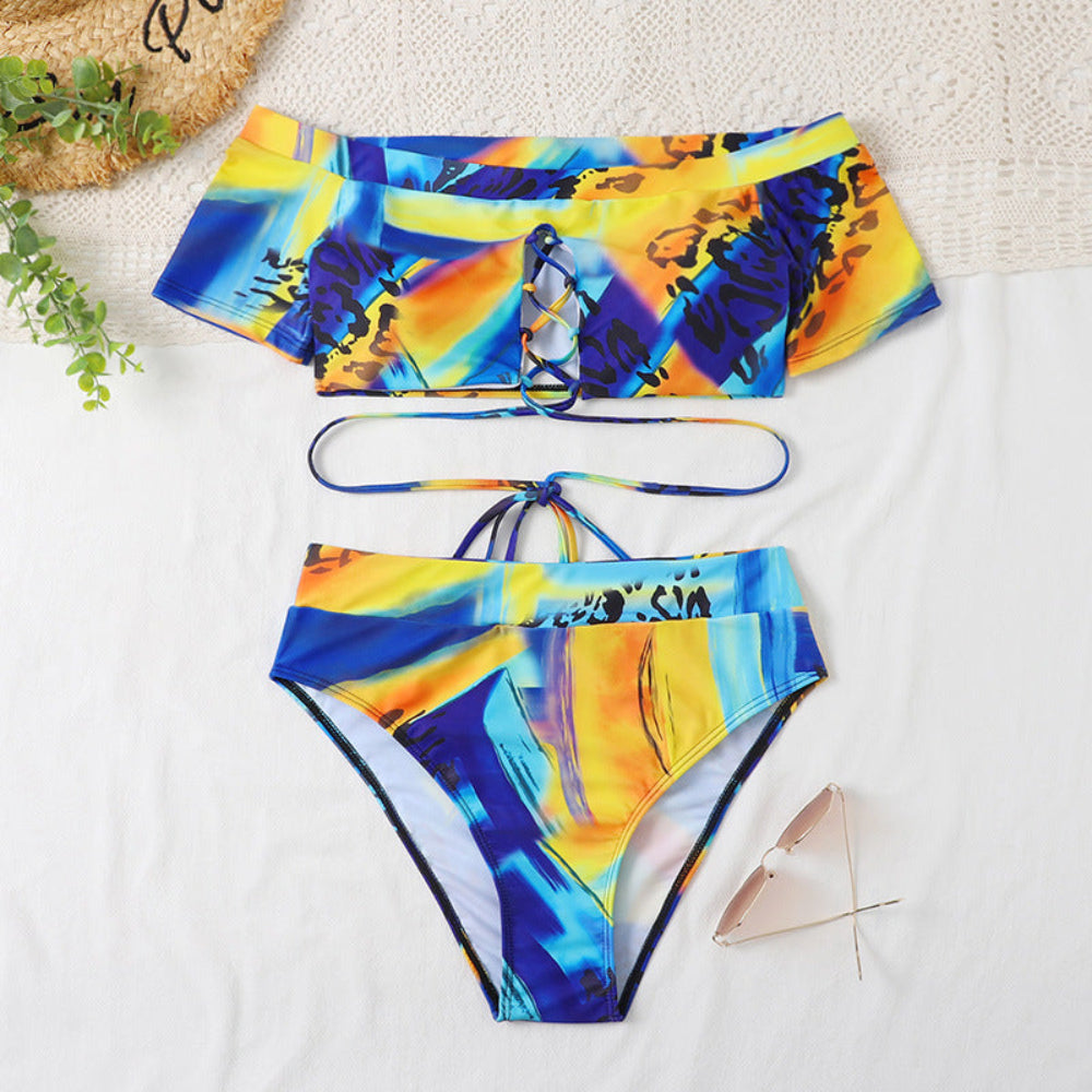 Colorful bikini set with abstract design on a white surface