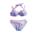 Purple and blue bikini set on a white background