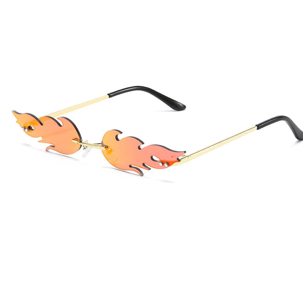 Rimless flame-shaped sunglasses with orange lenses and gold temples, product photo on a white background.