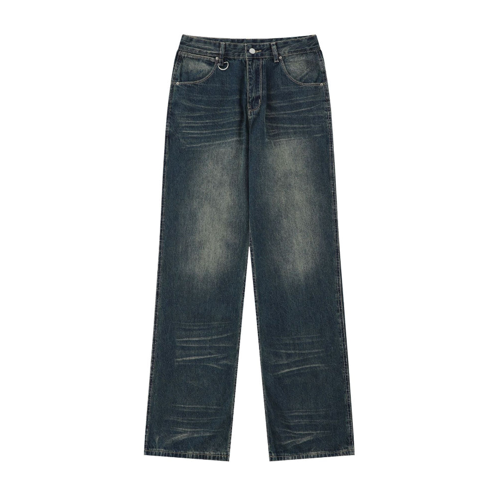 Dark blue wide-leg distressed jeans with subtle fading and whiskering details, laid flat on a white background. Casual unisex-style denim product photography for Boutique Jolie.