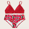 Red bikini set with watermelon pattern on a beige background