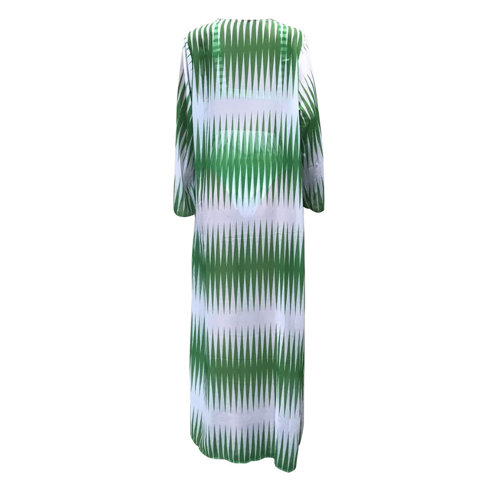 Green and white patterned dress on a white background