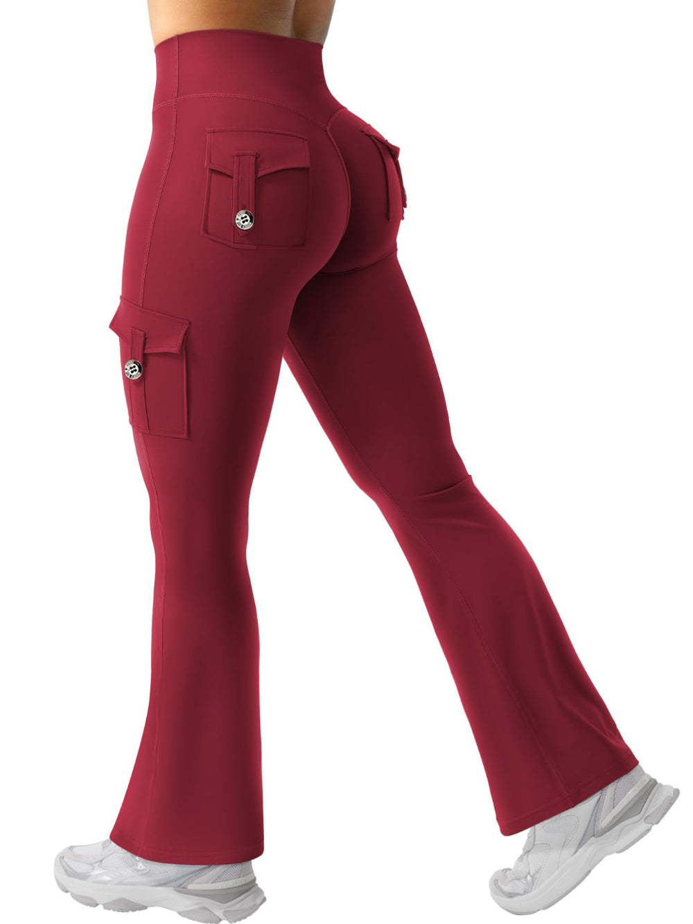 Woman modeling red high-waisted flared cargo pants with side and back pockets, shown from a rear three-quarter view against a clean white studio background.