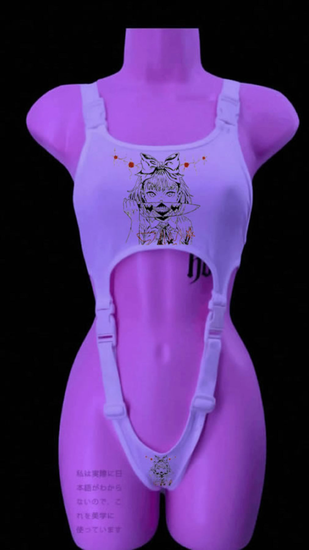 White harness-style crop top on a mannequin with adjustable buckle straps and side cut-outs. Features a detailed anime girl graphic with bow and splatter details on the chest, plus a smaller matching graphic at the bottom, displayed under pink lighting with Japanese text visible.