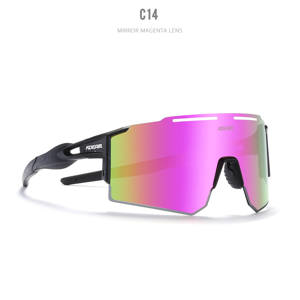 Bold black performance sport sunglasses featuring a large pink-to-green iridescent mirrored shield lens and sleek futuristic frame