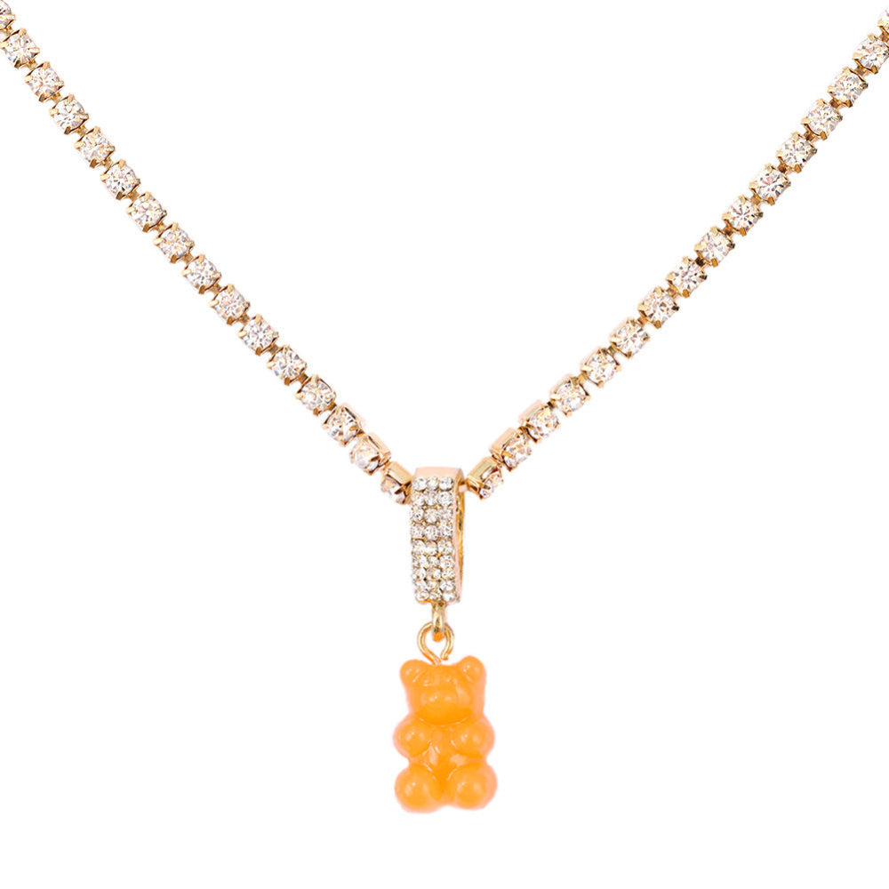 Tennis chain necklace with orange gummy bear pendant – trendy silver bling chain with fun bear charm, statement jewelry.