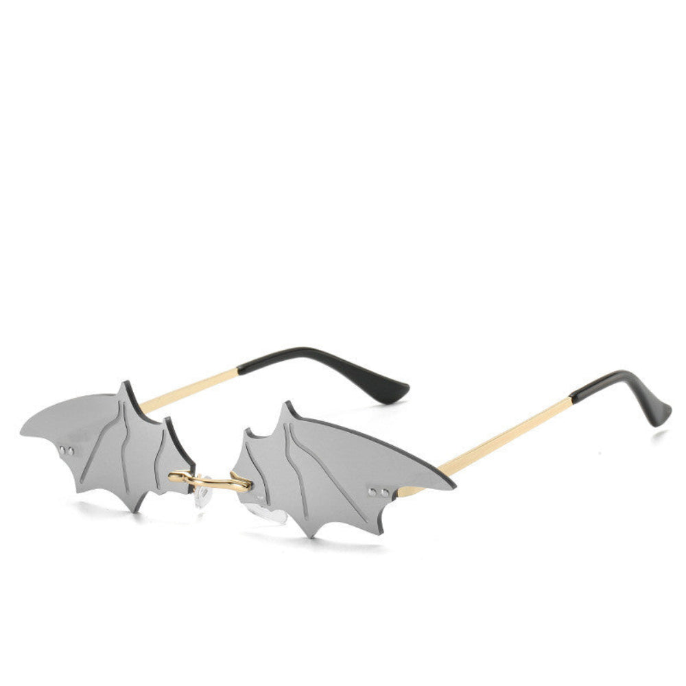 Rimless silver-mirror bat-wing sunglasses with gold temples, product photo on a white background.