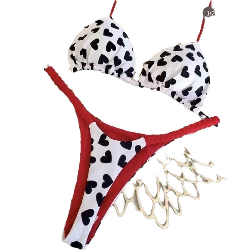 Bikini set with black heart patterns on a white background