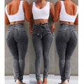 Three-panel collage of woman modeling grey high-waisted skinny jeans and a white crop top, showcasing front, side, and back views. Trendy casual denim fashion photography for Boutique Jolie.