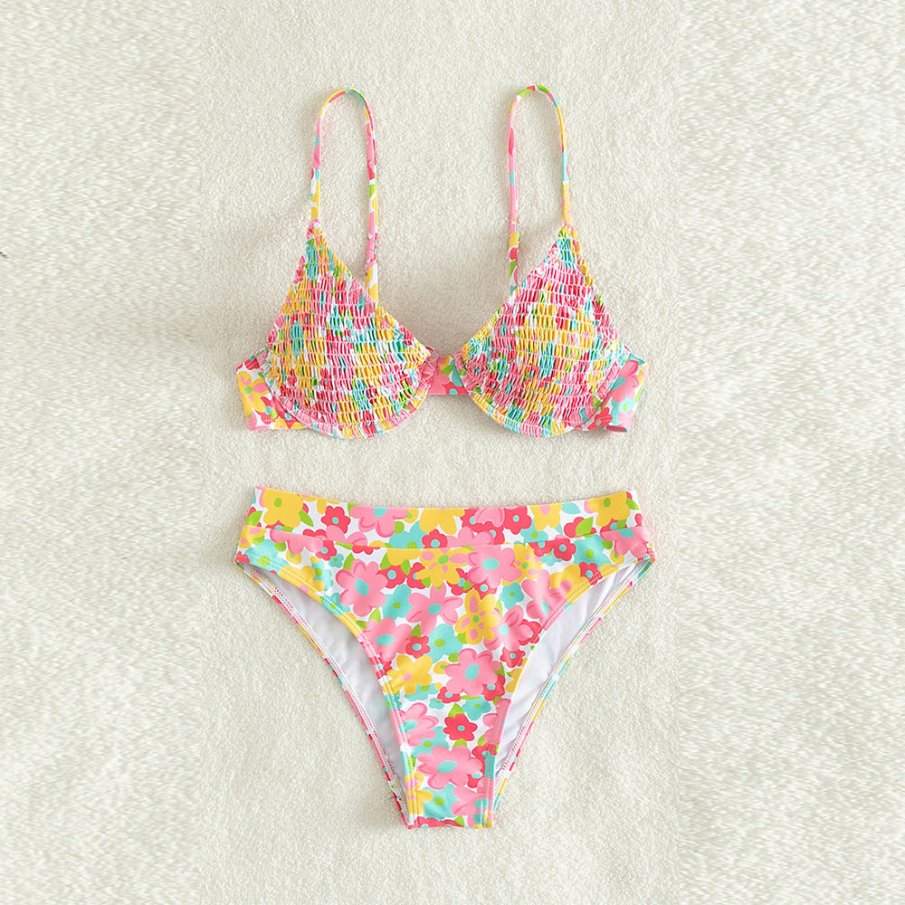 Colorful floral bikini set on a light gray background