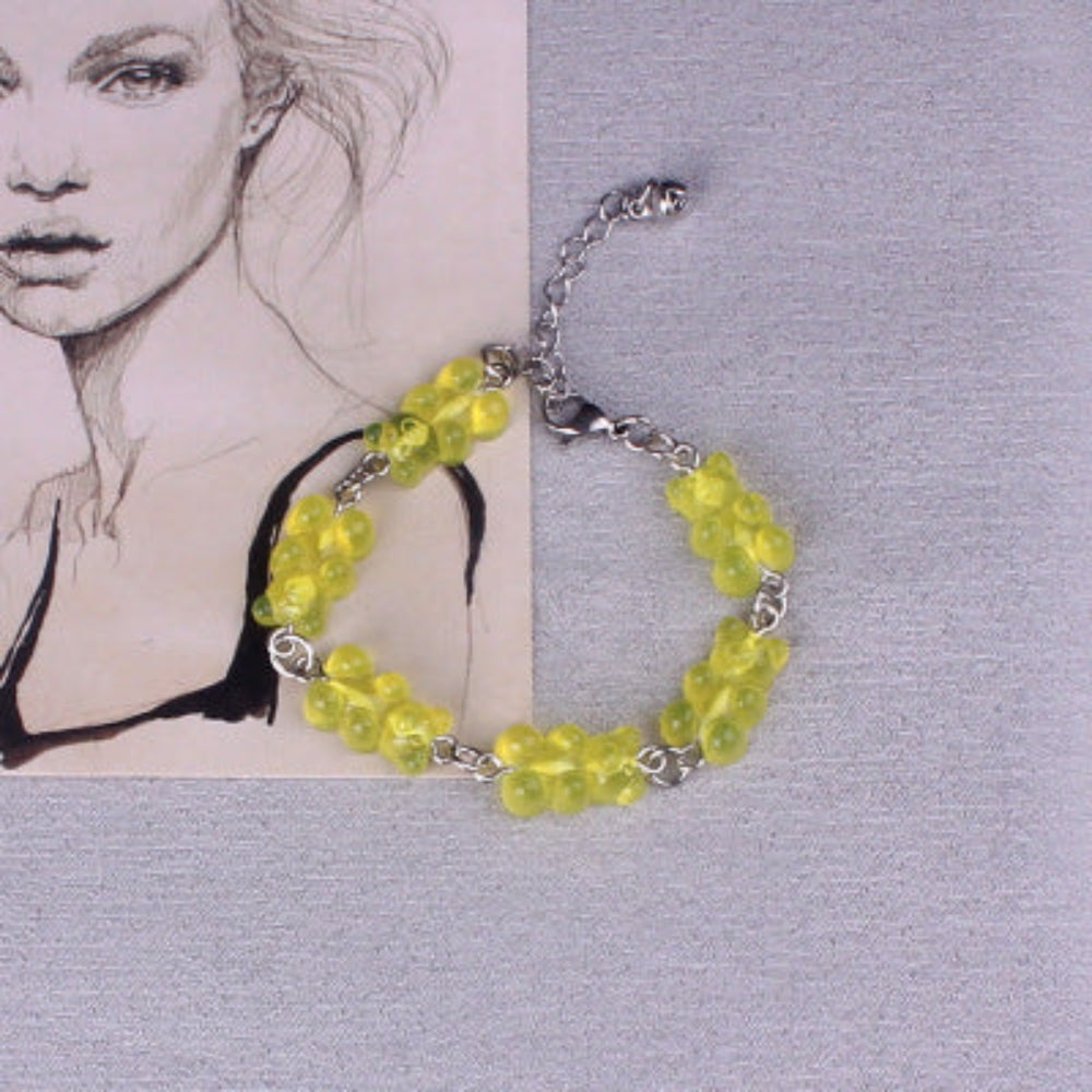 Chartreuse yellow translucent beaded bracelet with silver-tone chain links, lobster clasp, and extender chain.