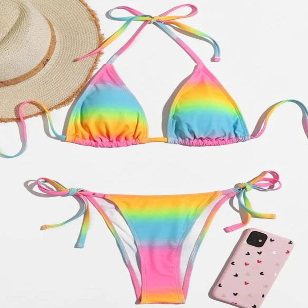 Rainbow tie-dye two-piece bikini set with triangle halter top and tie-side bikini bottom.