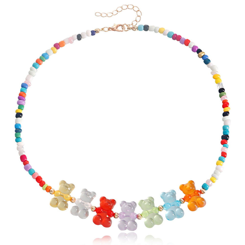 Rainbow beaded choker necklace with multicolored seed beads and seven vibrant translucent gummy bear charms in yellow, clear, red, purple, green, blue, and orange.