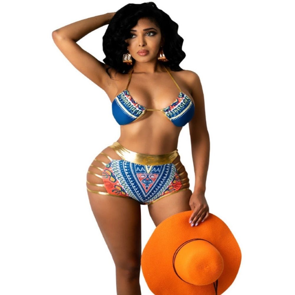 Woman in a colorful bikini holding an orange hat on a white background