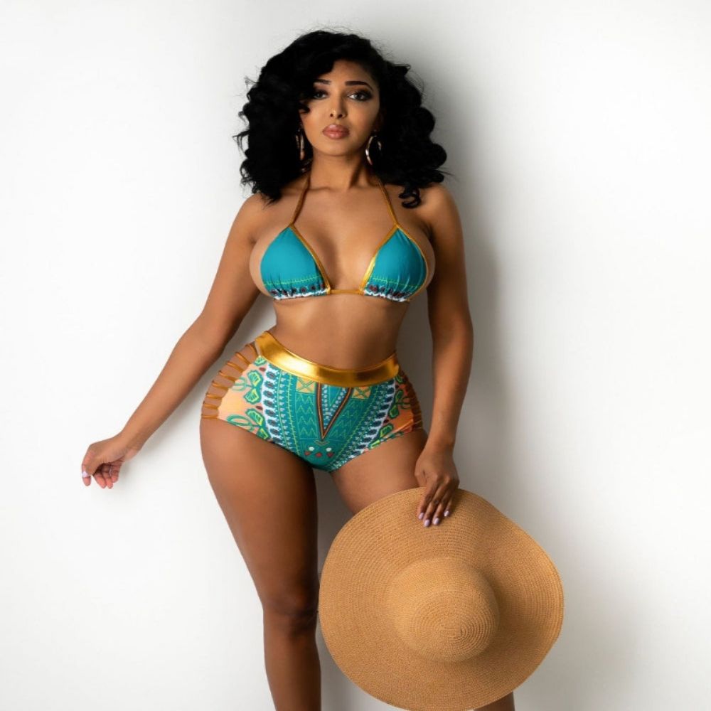 Woman in a colorful bikini holding a straw hat on a white background