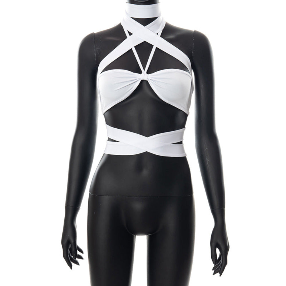Full front view of a black mannequin wearing a white halter crop top featuring a dramatic crisscross strap design at the neck, front cutouts, and wrapped bands around the midriff, showcasing the stylish, stretchy, and flattering fit.