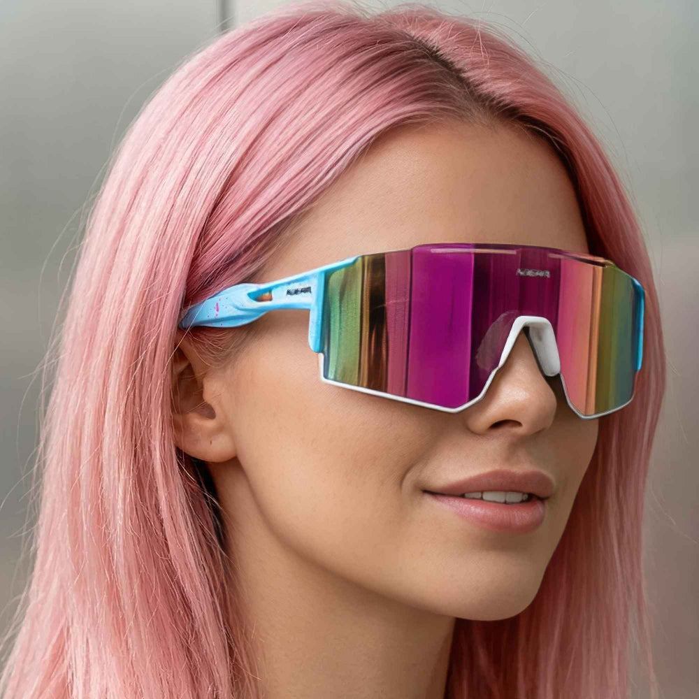Futuristic reflective shield sunglasses on pink hair model – trendy blue frame iridescent sunnies, fashion close-up.