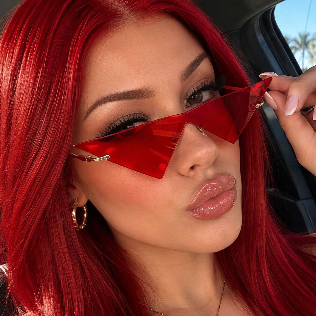 Catwalk Shield Pop Sunglasses lifestyle photo in a red geometric frame.
