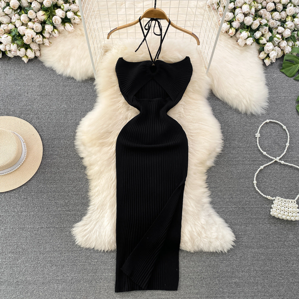 Black ribbed knit halter maxi dress with front keyhole cutout on wooden hanger.