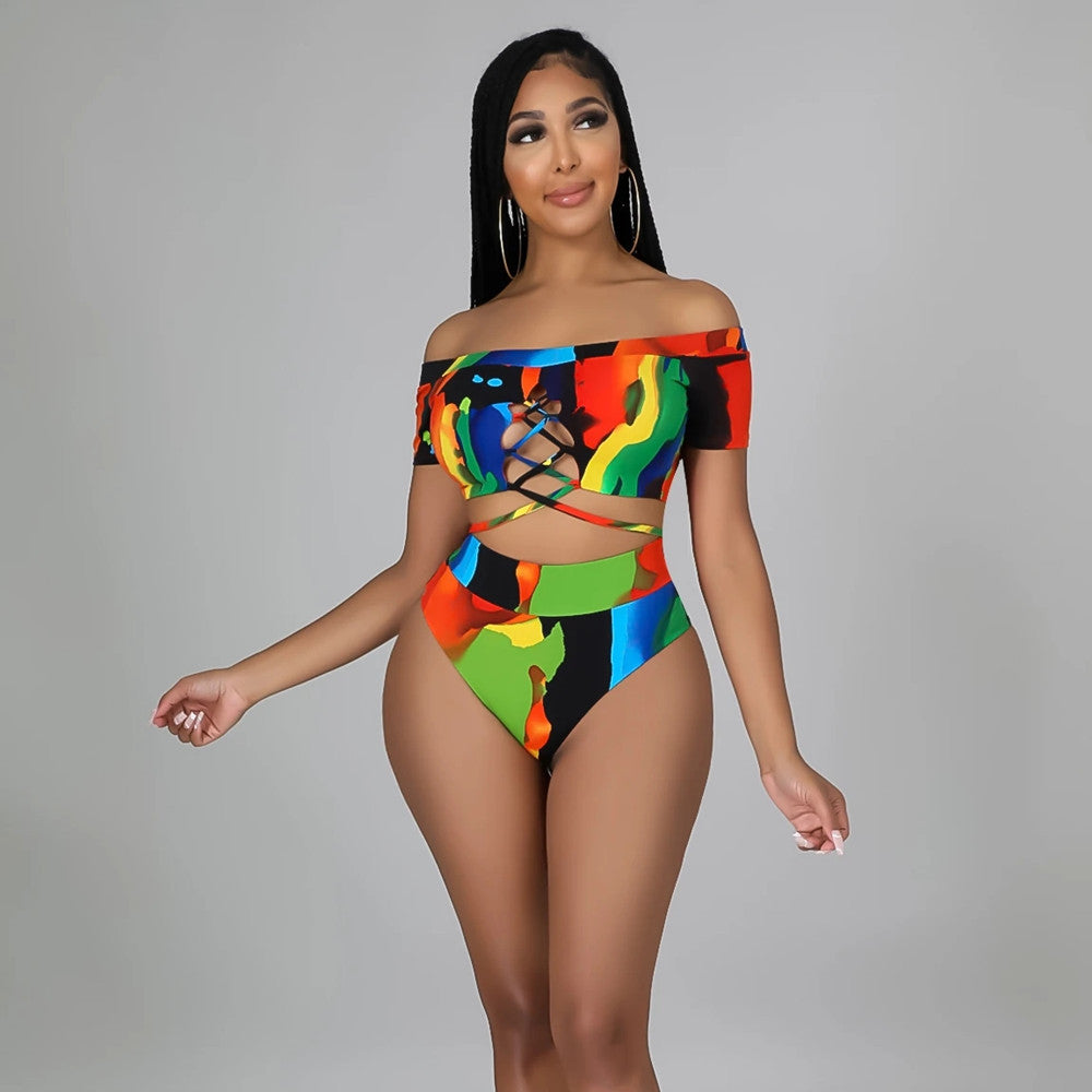 Woman wearing a colorful off-shoulder swimsuit against a gray background