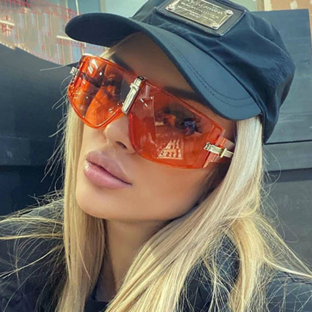 Orange oversized shield sunglasses with silver bridge