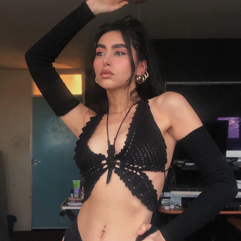 Black crochet halter bikini top with long sleeve arm warmers on model.