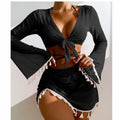 Black long sleeve tie-front crop top and ruched tassel mini skirt matching beach set.