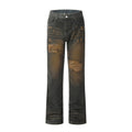 Dark gray black distressed ripped jeans with knee holes and faded wash flat lay.