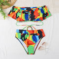 Colorful bikini set with abstract pattern on a white surface