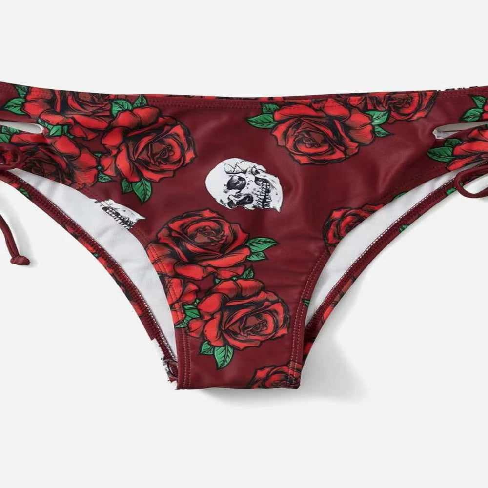 Red bikini bottom with rose pattern on a white background