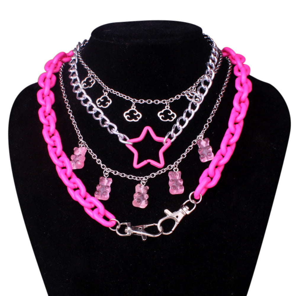 Pink star and teddy bear charm layered necklace set – trendy chunky pink silver chain statement jewelry on mannequin bust.