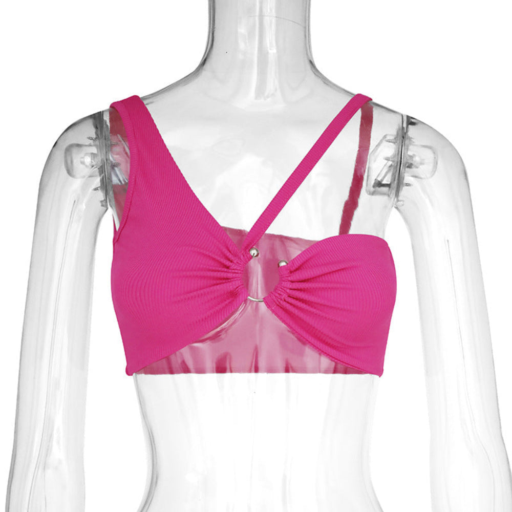 Pink ribbed bralette with front ruched gathering, silver O-ring hardware, and adjustable crisscross back straps, displayed on a clear mannequin.