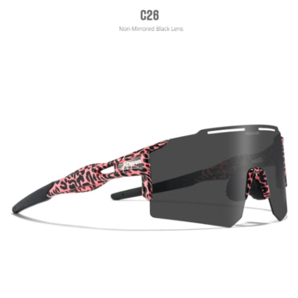 Oakley sunglasses featuring bold pink and black leopard print on the frame, matte black arms, and a large dark smoke mirrored shield lens