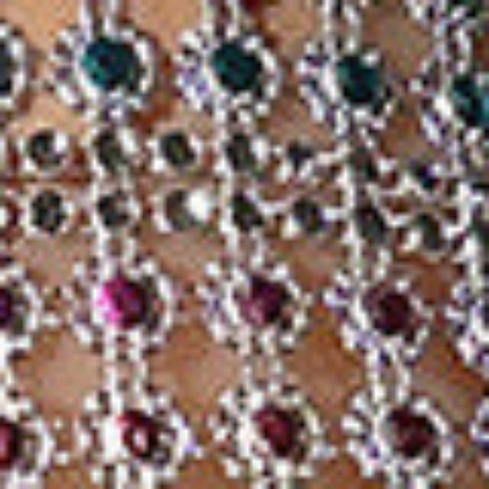 Close-up of intricate multicolored rhinestone embellishment featuring emerald green, pink, purple, and clear crystals arranged in a sparkling silver lattice and floral pattern.
