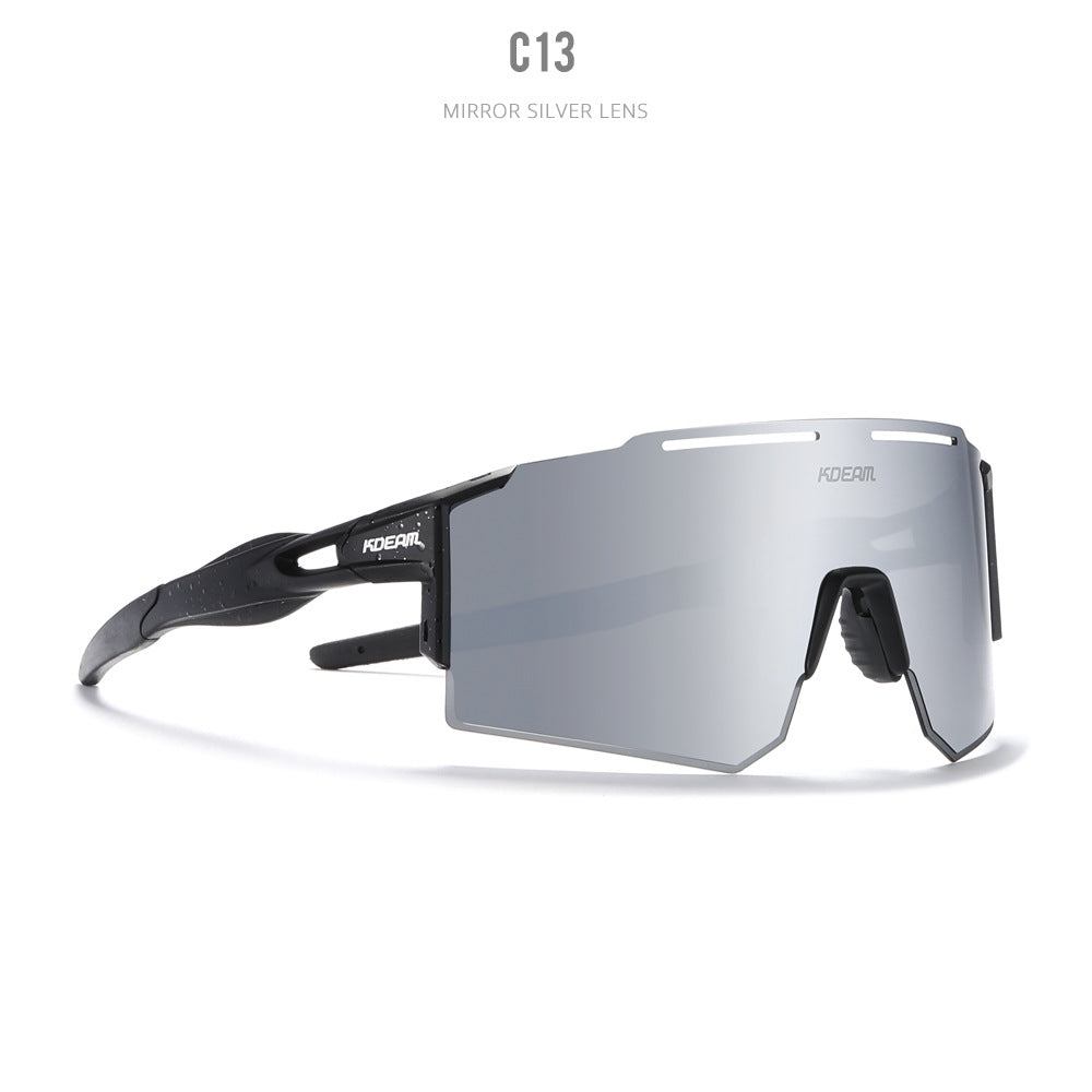 Sleek black performance sport sunglasses featuring a large silver mirrored shield lens, futuristic visor design, and lightweight frame