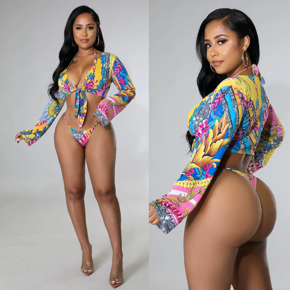 Woman wearing a colorful patterned outfit on a gray background
