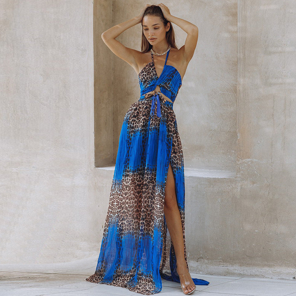 Blue leopard print maxi dress on model – trendy animal print color-block long dress with slit and halter neck, stone wall studio setting.