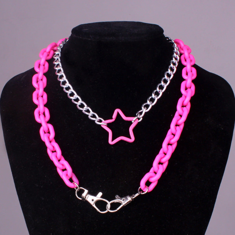 Pink star pendant chunky chain necklace – trendy pink and silver layered statement jewelry on mannequin.